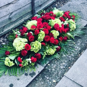 Mixed casket spray red and green
