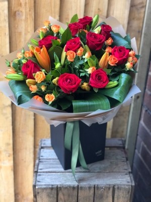 Luxury Red Rose and Lily Hand tied with chocolates