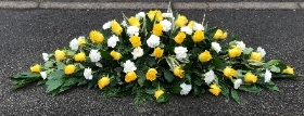Rose and carnation casket spray yellow and white
