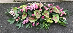rose orchid and calla lily casket spray
